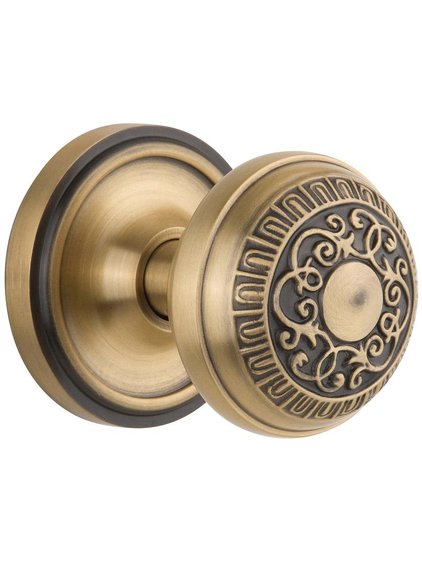 Classic Rosette Set With Egg And Dart Door Knobs Single Dummy in Antique Brass.